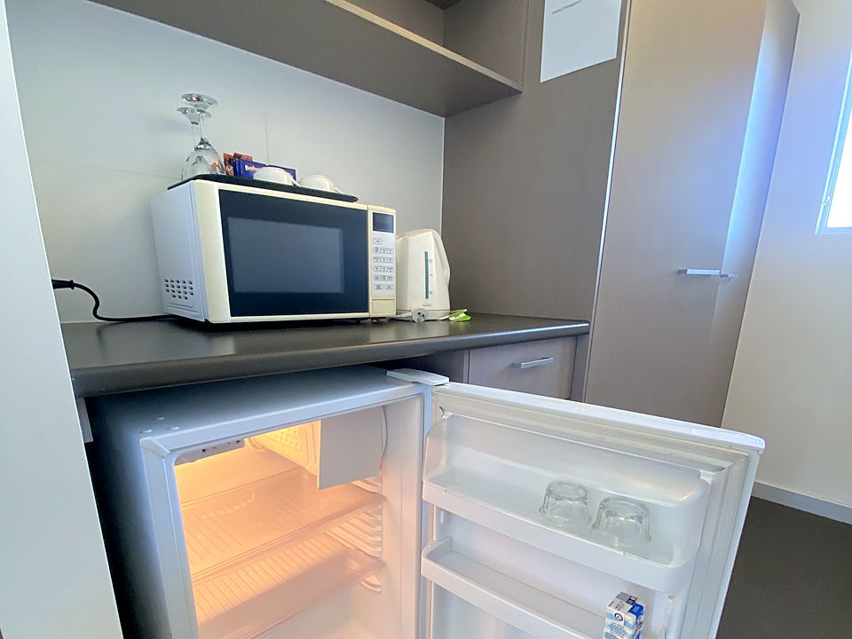 In-room kitchenette with fridge, microwave and kettle
